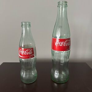 Coca-Cola Green Glass Bottles with Iconic Red Labels